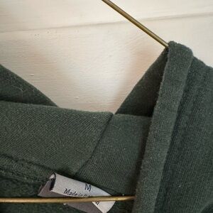 Dark Green Cozy Sweater. Official Oswego State merch.